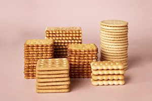 Stacks of cookies on a pink background