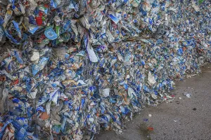 Stacks of empty and crushed beverage containers ready for recycling