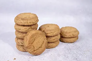 Stacks of homemade oatmeal cookies on a white background