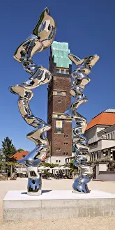 Stainless steel sculpture entitled Points of View by Tony Cragg in front of the Wedding Tower