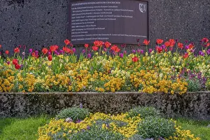 Staircase with spring flowers and information sign
