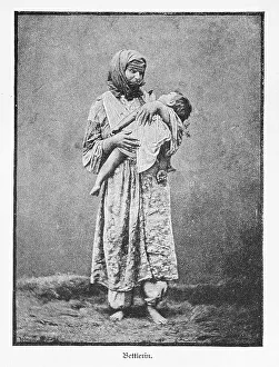 Standing beggar woman with child