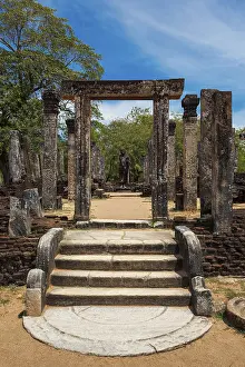 Standing Buddha statue in ancient ruins