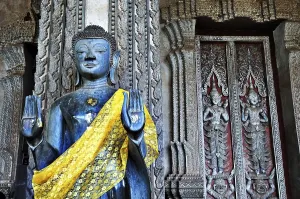 Category Buddhism Prints: Standing Buddha statue in front of the Lao National Museum in Vientiane