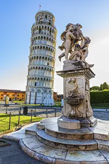 Statue with angels, behind the Leaning Tower