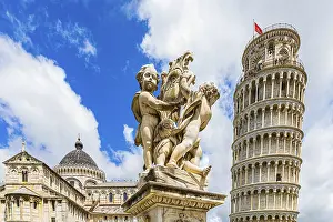 Statue of angels, behind the Leaning Tower and the Cathedral of Santa Maria Assunta