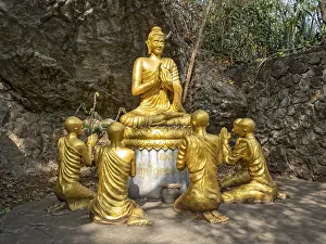 Statue of Buddha teaching disciples
