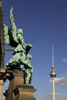 Statue on the dome of Berlin Cathedral and TV Tower