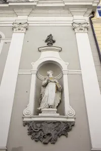Statue in the exterior niche of St Michael 18th century church in Budapest