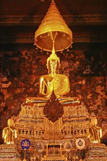 Statue of a golden Buddha inside a temple in Bangkok