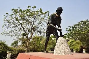 Statue of Mahatma Gandhi collecting salt, Dandi, Gujarat, India, Asia