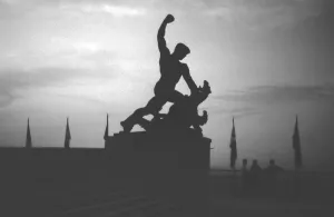 Statue with a man fighting against dragon