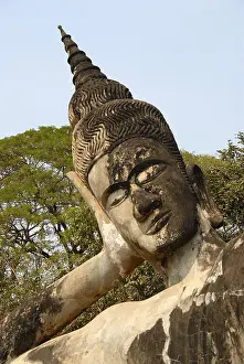 Statue of a reclining buddha leaning on his hand