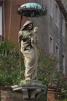 Statue of the Virgin with Christ Child under a canopy