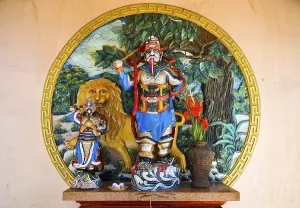 Category Buddhism Prints: Statue on a wall, Buddhist god