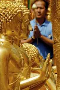 Statues and people at a Buddhist temple in Chiang Mai