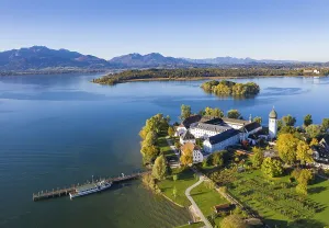 Steam jetty and Benedictine monastery Frauenwoerth on Fraueninsel