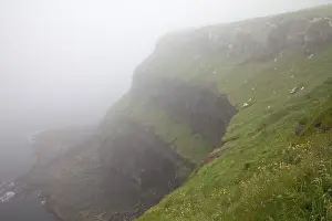 Steep coast in the fog, Vagar, Faroe Islands