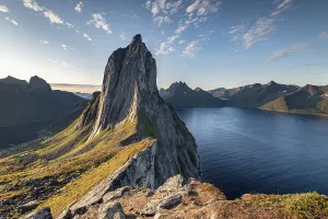 Steep mountain Segla, fjord Mefjorden with mountains