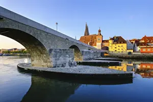 Stone bridge over the Danube and Old Town with bridge gate