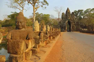Stone carved statues of Devas on the bridge to Angkor Thom