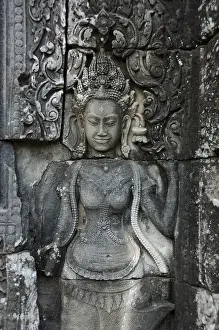 Stone carving of a female face