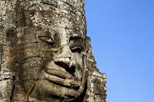 Stone Face sculpture in Angkor Wat temple near Siem Reap in Cambodia