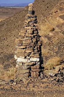 Stone pile in a dry, rocky desert landscape