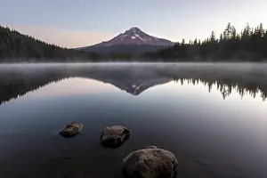 Three stones in the water, reflection of the volcano Mt