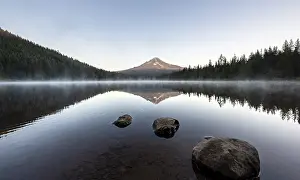 Three stones in the water, reflection of the volcano Mt