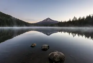 Three stones in the water, reflection of the volcano Mt