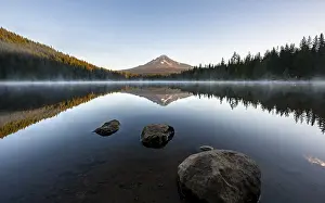Three stones in the water, reflection of the volcano Mt