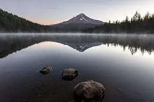 Three stones in the water, reflection of the volcano Mt