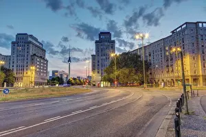 Strausberger Platz in Berlin with the TV tower in the background after sunset
