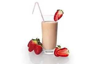 Strawberry drinking yoghurt, strawberries and strawberry shake in a glass