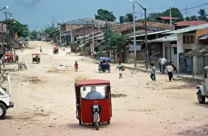 Street, houses, people, tuk-tuks