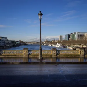 A street light stands tall on a bridge