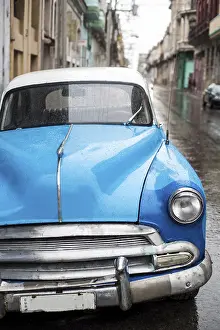 Framed Print : Street scene with old car on rainy day in Havana