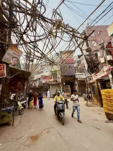 Street scene with people and hanging cables