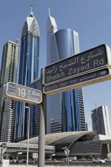 Street sign for Sheikh Zayed Road in front of skyscrapers