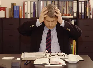 Stress at work, headaches Office scene