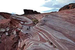 Striped rocks in the desert during dramatic cloud play