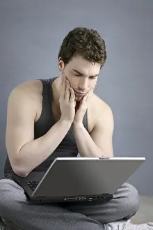 Student gesture with laptop over gray background