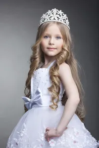 Studio portrait of pretty little girl in tiara