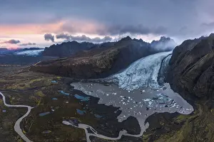 Stunning aerial shot capturing the expansive Vatnajokull Glacier winding through rugged mountains