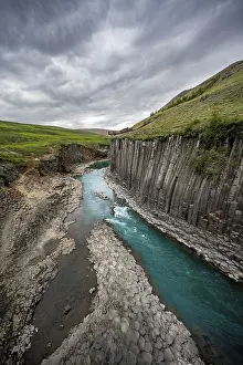 Stuolagil Canyon, turquoise river between basalt columns