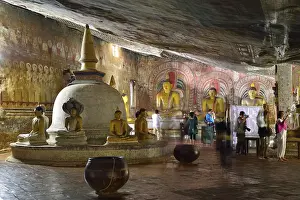 Stupa, Buddha statues and murals in one of the cave temples of the Golden Temple