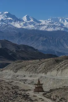 Stupa in a desert landscape before the Annapurna mountain range