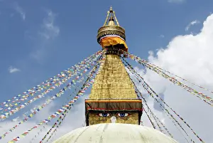 Stupa with prayer flags and eyes of Buddha