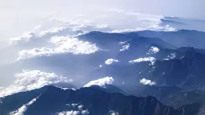 Sublime mountain landscape with clouds and clear sky in a large panorama